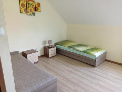 a bedroom with two beds and two night stands at Hotel Romantyczny in Międzyrzec Podlaski