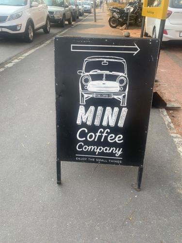 a sign for a mini coffee company on a street at The Tipsy Expat in Paarl