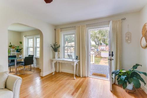a living room with a couch and a table and a door at Chic Front Royal Retreat Near Shenandoah River! in Front Royal