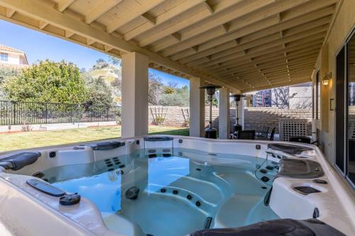 a jacuzzi tub on a patio with a view at The Nest at Woodside: Lux LA getaway + office/spa in Santa Clarita