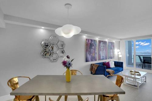 a living room with a table and a couch at Cloud Nine! Direct Water Views of Bay & Ocean! in Miami