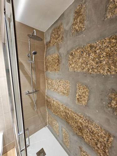 a bathroom with a wall covered in corrugated at Quinta de Casal do Bairro - Casa do Alpendre in Guimarães