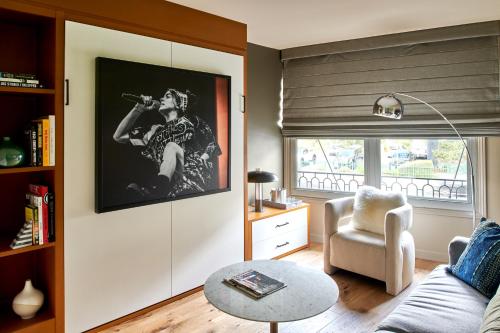 a living room with a couch and a table at Hotel Ziggy On Sunset in Los Angeles