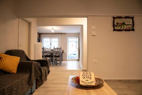 a living room with a birthday cake on a table at Ραστώνη in Drama