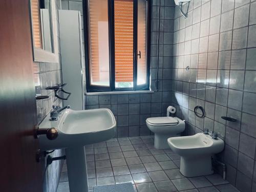 a bathroom with a sink and a toilet at Country House Nora Rech in SantʼElpidio a Mare