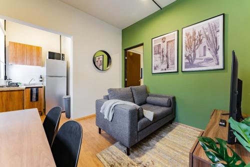 a living room with a couch and a table at Lofts & apartments Near Polanco by VH in Mexico City