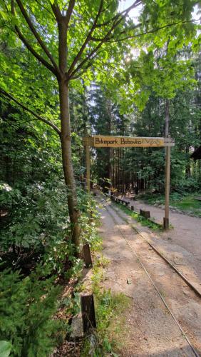 a bench in a park with a sign on it at Brave Lama in Tanvald