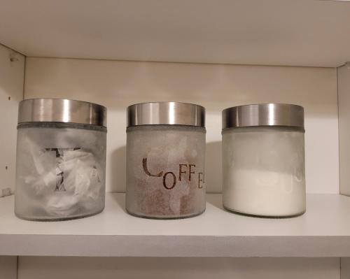 threeason jars on a shelf in a kitchen at Cozy Central One Bedroom Flat in Reading