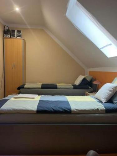 Postel nebo postele na pokoji v ubytování Noclegi Wilga