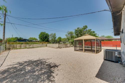 a building with a gazebo on a gravel driveway at Modern Home in Edinburg Half-Mi Walk to UTRGV! in Edinburg