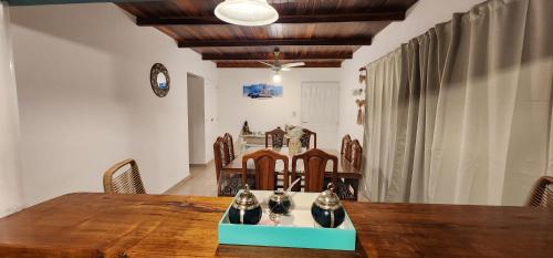 a dining room with a wooden table and chairs at H2O CENTRO in Federación