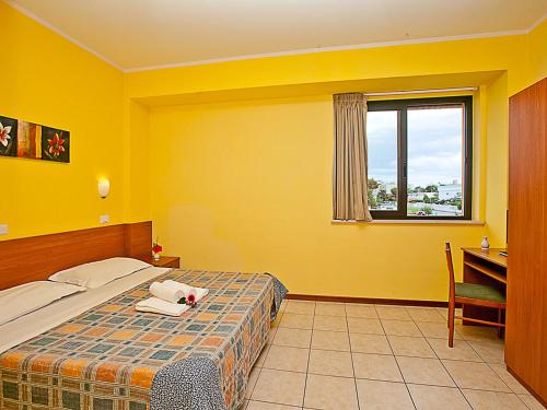 Postel nebo postele na pokoji v ubytování Albergo San Gabriele