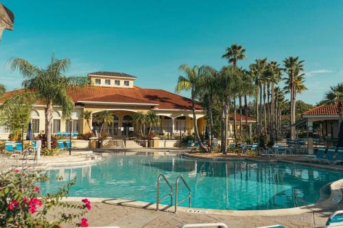 a large swimming pool in front of a resort at Roomy House Near Disney with Resort Pool and Patio BBQ in Kissimmee