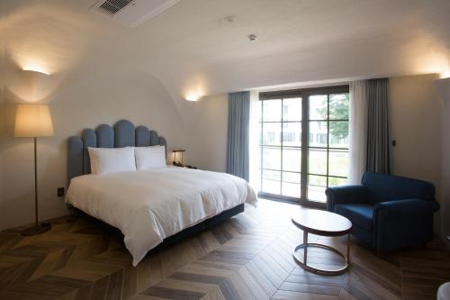 Ein Bett oder Betten in einem Zimmer der Unterkunft Ecoland Hotel