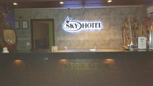 a sign for a ski hotel on a wall at Sky Hotel in Hwaseong