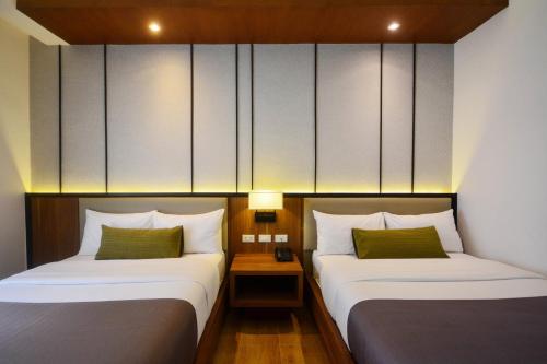 Postel nebo postele na pokoji v ubytování Sotogrande Hotel Palawan