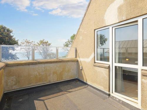 an empty balcony of a building with a window at Seaside Charm in Gedser - By Traum Ferienwohnungen in Gedser