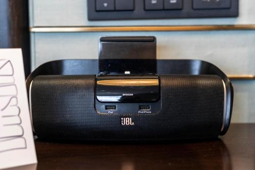 a toaster sitting on a table next to a keyboard at Waldorf Astoria Beijing in Beijing