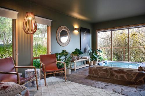 a living room with a jacuzzi tub at Kuca Stone in Daylesford