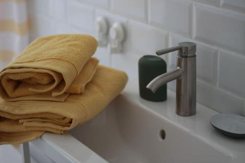 a towel sitting on a sink next to a faucet at El paller de L´Armentera 3 in Saldet