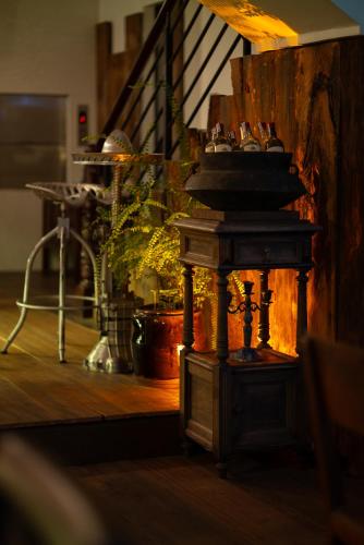 a wooden table with a sink in a room at Amanaki Thao Dien in Ho Chi Minh City
