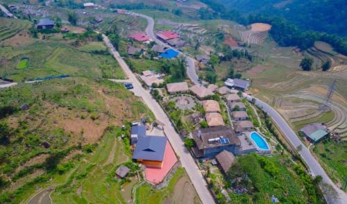 an aerial view of a village with houses and a road at Sapa Eco Villas & Spa in Sa Pa