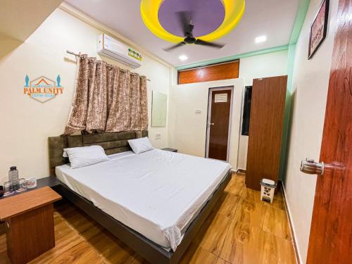 Postel nebo postele na pokoji v ubytování THE PALM UNITY HOME STAY