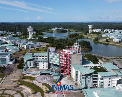 an aerial view of a city with a river and buildings at Summer Mall Summer Suite 2 bedroom unit in Kota Samarahan