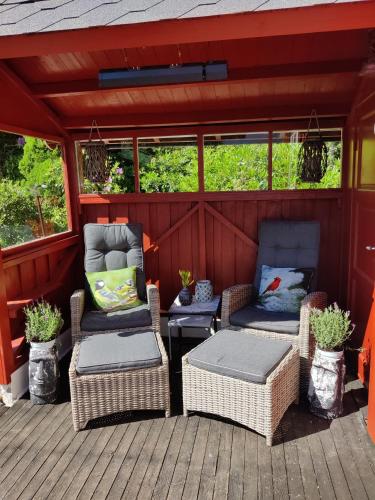 a porch with two chairs and a table and two chairs at Fjord peace in Skodje