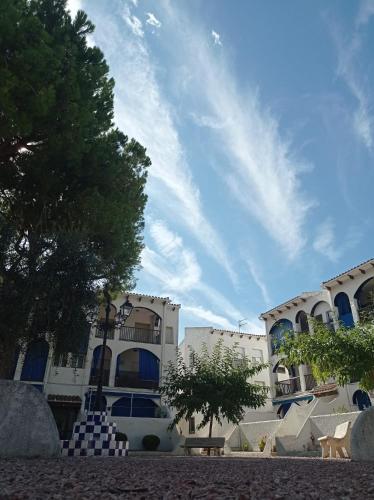 a building with a blue sky in the background at Apartamento, 3° línea de playa in Cubelles