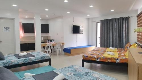 Postel nebo postele na pokoji v ubytování Maria Cristesa Condotel