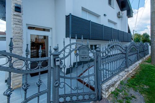 a black wrought iron fence in front of a house at Holiday Home Crux in Krizanec