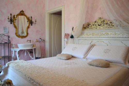 Postel nebo postele na pokoji v ubytování B&B La Maison degli Angeli