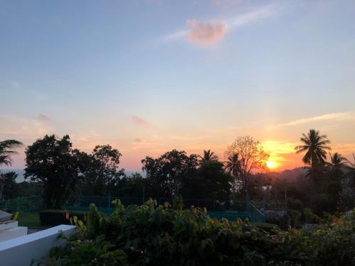 a sunset seen from the roof of a house at Samui Blu, villa with private pool in Choeng Mon Beach