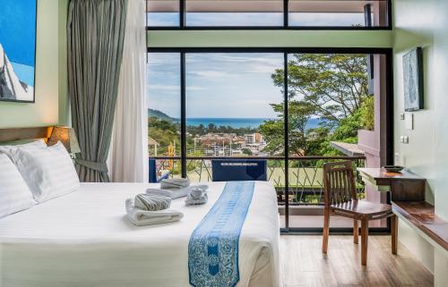 Ένα ή περισσότερα κρεβάτια σε δωμάτιο στο CC's Hideaway Kata - SHA Plus