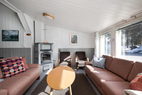 a living room with a couch and a table at Levilehto Apartments in Levi