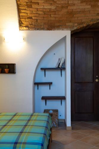 Кровать или кровати в номере Officine Bordighera