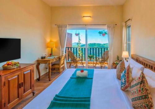 a living room with a couch and a television at Sleeping Beauty by Nature Resorts and Stays in Coonoor