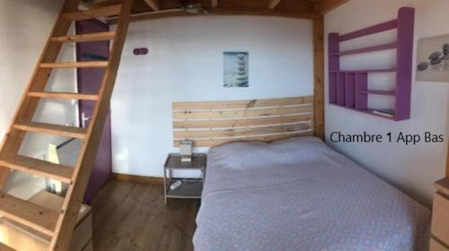 a bedroom with a bunk bed and a ladder at Villa La Viva Porticcio in Porticcio