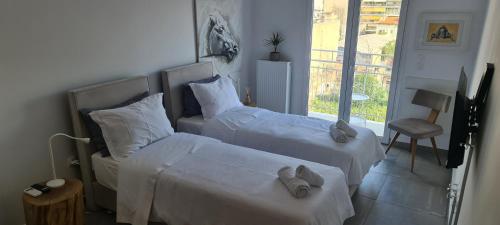 Un pat sau paturi într-o cameră la Kalliopis Apartment