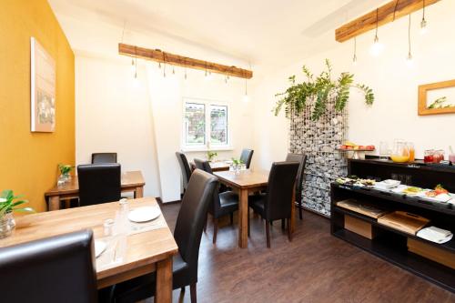 a dining room with a table and chairs at S'Matt Bob in Feldkirch