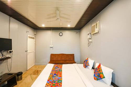 a bedroom with a large white bed in a room at FabHotel Raka Inn in Allahābād