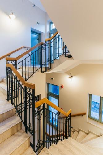 an image of a staircase in a house at NOZON Apartments & Wellness in Odorheiu Secuiesc
