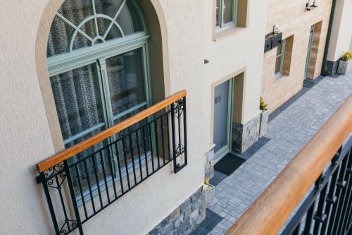 a balcony of a building with a window at NOZON Apartments & Wellness in Odorheiu Secuiesc