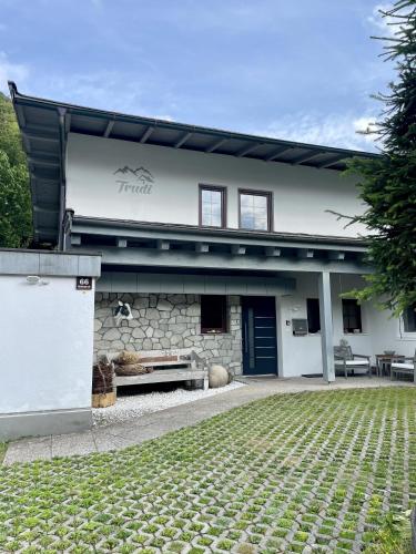 a building with a bench in front of it at Haus Trudi in Walchsee