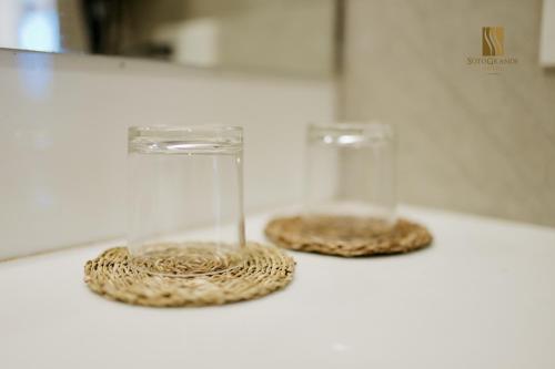 two glasses sitting on top of a counter at Sotogrande Davao Hotel in Davao City