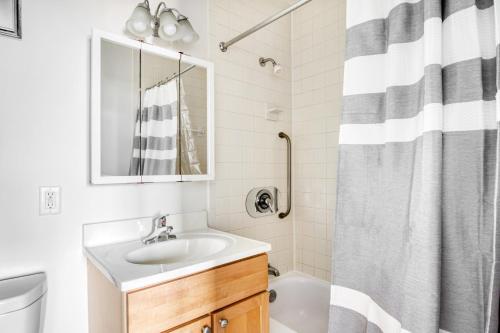 a bathroom with a sink and a shower at Cambridge 1BR nr restaurants steps from Train BOS-518 in Cambridge