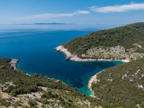 a view of the island of šibenik from a hill at Stone House Harmony in Korčula