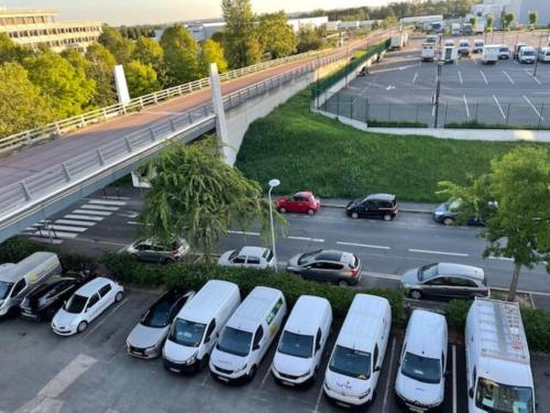 a parking lot with a bunch of cars parked at Premiere Classe Rungis - Orly in Rungis