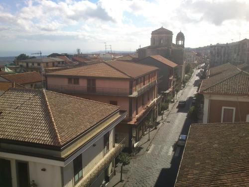 a view of a town with buildings and a street at Cartoline Dall'Etna B&b in Zafferana Etnea
